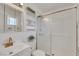 Bright bathroom featuring a glass-enclosed shower, and a modern vanity with stylish fixtures at 415 Emerald Cir, Henderson, NV 89002