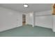 Carpeted bedroom space with closet, door to next room, and overhead lighting at 415 Emerald Cir, Henderson, NV 89002