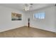 Minimalist bedroom design offering wood-look floors, neutral walls, and lots of natural light through the window at 415 Emerald Cir, Henderson, NV 89002