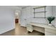 Bright bedroom with a desk, shelves, and wood-look floors at 415 Emerald Cir, Henderson, NV 89002