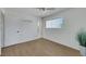 Bright bedroom featuring wood-look floors, a ceiling fan, and an attached bathroom for convenience at 415 Emerald Cir, Henderson, NV 89002