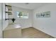 Bright bedroom with built-in shelves, desk and wood-look floors at 415 Emerald Cir, Henderson, NV 89002