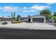 Single-story home showcasing a two-car garage, low-maintenance front yard, and classic design at 415 Emerald Cir, Henderson, NV 89002