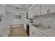 Bright kitchen features stainless steel appliances, stylish backsplash and ample countertop space at 415 Emerald Cir, Henderson, NV 89002