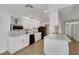 Bright kitchen with white cabinets, countertops, stainless appliances, and tile backsplash at 415 Emerald Cir, Henderson, NV 89002