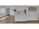 Open kitchen features white cabinets, modern appliances and a large center island at 415 Emerald Cir, Henderson, NV 89002