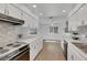Kitchen with white cabinets, countertops, tile backsplash and stainless steel appliances at 415 Emerald Cir, Henderson, NV 89002