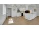 Open-concept kitchen with white cabinets, stainless steel appliances and adjacent dining area at 415 Emerald Cir, Henderson, NV 89002