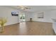 Bright living room with sliding glass doors, vinyl floors, and neutral wall colors at 415 Emerald Cir, Henderson, NV 89002