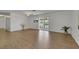 Spacious living room featuring vinyl floors, sliding glass doors, and light-colored walls at 415 Emerald Cir, Henderson, NV 89002