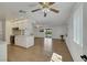 Open-concept living space with light floors seamlessly connecting the kitchen and living areas at 415 Emerald Cir, Henderson, NV 89002