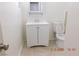Bright bathroom featuring a white vanity with storage and a tiled floor at 4382 Pinegrove St, Las Vegas, NV 89147
