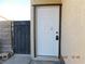 A secure and stylish white entry door to the home, framed with decorative trim at 4382 Pinegrove St, Las Vegas, NV 89147