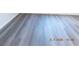 Freshly installed modern gray vinyl flooring at 4382 Pinegrove St, Las Vegas, NV 89147
