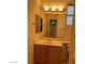 Bright bathroom featuring a vanity with a sink, mirror, and vanity lighting at 5049 Alfingo St, Las Vegas, NV 89135
