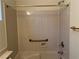 Bathroom with a shower and bathtub combination with a safety bar at 5049 Alfingo St, Las Vegas, NV 89135