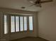 Bright bedroom features a large window with shutters and carpet flooring at 5049 Alfingo St, Las Vegas, NV 89135