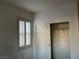 Bedroom featuring window with shutters and a walk-in closet at 5049 Alfingo St, Las Vegas, NV 89135