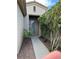 Welcoming walkway leading to a charming front door, framed by lush greenery at 5049 Alfingo St, Las Vegas, NV 89135