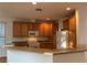 Functional kitchen with ample cabinet space, gas range, and an eat-in breakfast bar at 5049 Alfingo St, Las Vegas, NV 89135