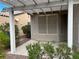 Covered patio with desert landscaping and privacy screens at 5049 Alfingo St, Las Vegas, NV 89135