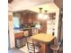 Cozy kitchen with a breakfast bar and white appliances at 508 Tara Ct, Boulder City, NV 89005