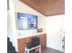 Cozy living room with a large flat screen TV and wood wall panelling at 508 Tara Ct, Boulder City, NV 89005