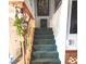 Carpeted staircase featuring a wooden banister and railing at 508 Tara Ct, Boulder City, NV 89005
