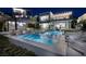 This backyard features a large pool, seating, and an outdoor kitchen at 523 Overlook Rim Dr, Henderson, NV 89012