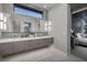 This bathroom offers a double vanity, lots of storage, and a large mirror at 523 Overlook Rim Dr, Henderson, NV 89012