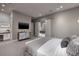 Cozy bedroom with comfortable bed, sleek TV, and contemporary design elements creating a peaceful atmosphere at 523 Overlook Rim Dr, Henderson, NV 89012
