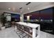 Dining area features stylish bar seating and breathtaking panoramic city views, ideal for elegant gatherings at 523 Overlook Rim Dr, Henderson, NV 89012