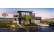 Stunning contemporary home featuring modern architecture, sleek lines, and a beautifully landscaped front yard at 523 Overlook Rim Dr, Henderson, NV 89012