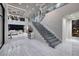 Spacious foyer featuring a modern staircase, elegant chandelier, and inviting entryway at 523 Overlook Rim Dr, Henderson, NV 89012