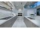 Contemporary kitchen featuring modern cabinetry, stainless steel appliances, and marble backsplash at 523 Overlook Rim Dr, Henderson, NV 89012