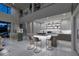 Elegant kitchen featuring marble countertops, stainless steel appliances, and seamless integration with living area at 523 Overlook Rim Dr, Henderson, NV 89012