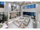 Luxurious living room boasting a modern fireplace, stylish furnishings, and access to an outdoor pool area at 523 Overlook Rim Dr, Henderson, NV 89012