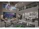 Open-concept living space with soaring ceilings, city views, and a gourmet kitchen with sleek countertops at 523 Overlook Rim Dr, Henderson, NV 89012