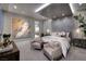 This main bedroom features a textured wall, recessed lights, and a sitting area at 523 Overlook Rim Dr, Henderson, NV 89012