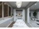 Bright spa room with a massage table, decorative art, and hardwood floors, designed for ultimate relaxation at 523 Overlook Rim Dr, Henderson, NV 89012