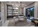 Stylish office with custom built-ins, modern desk, and large windows offering ample natural light at 523 Overlook Rim Dr, Henderson, NV 89012
