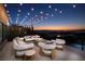 Inviting outdoor patio with comfortable seating and city views, perfect for enjoying sunsets and outdoor entertaining at 523 Overlook Rim Dr, Henderson, NV 89012