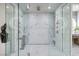 Luxurious glass-enclosed shower with dual showerheads and marble accents, creating a spa-like experience at 523 Overlook Rim Dr, Henderson, NV 89012