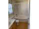 Bright bathroom features soaking tub, single vanity, and a window for natural light at 533 Via Santiago St, Las Vegas, NV 89144