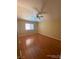Bedroom featuring hardwood floors, a ceiling fan, and natural light streaming through the window at 533 Via Santiago St, Las Vegas, NV 89144