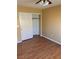 Bedroom with hardwood floors, closet with doors, and access to the hallway at 533 Via Santiago St, Las Vegas, NV 89144