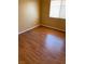 A corner bedroom with hardwood floors and a window providing natural light at 533 Via Santiago St, Las Vegas, NV 89144