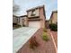 Two-story home with a two-car garage, concrete driveway, and a neutral-toned exterior at 533 Via Santiago St, Las Vegas, NV 89144