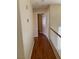 Upstairs hallway with hardwood floors leads to bedrooms and bathrooms at 533 Via Santiago St, Las Vegas, NV 89144