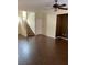 Open-concept living area showcasing wood floors, staircase, neutral walls, and abundant natural light at 533 Via Santiago St, Las Vegas, NV 89144
